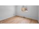 Empty bedroom with hardwood floors and a window view at 3830 Pineview Ln, Greenwood, IN 46142