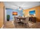 Bright dining room with hardwood floors, and virtually staged furniture at 3830 Pineview Ln, Greenwood, IN 46142