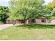 Brick ranch home with attached garage and spacious lawn at 3830 Pineview Ln, Greenwood, IN 46142