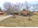 Brick-and-wood home with a two-car garage, featuring a charming front yard in a quiet neighborhood at 3830 Pineview Ln, Greenwood, IN 46142