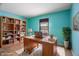 Home office with built-in shelves and wood desk at 3830 Pineview Ln, Greenwood, IN 46142