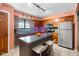 Functional kitchen features dark cabinets, modern appliances, and center island with seating at 3830 Pineview Ln, Greenwood, IN 46142