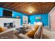 Bright living area showcases unique ceiling, fireplace, stylish furniture, and adjacent entryway at 3830 Pineview Ln, Greenwood, IN 46142