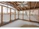 Screened porch with wooden ceiling and snow on the ground at 3830 Pineview Ln, Greenwood, IN 46142