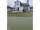 View of the back of the house, showing a patio and a small yard at 4059 Eagle Cove W W Dr, Indianapolis, IN 46254