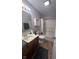 Clean bathroom with a shower/tub combo and wood vanity at 4059 Eagle Cove W W Dr, Indianapolis, IN 46254
