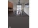 Modern dining room with a white table and chairs, overlooking a pond at 4059 Eagle Cove W W Dr, Indianapolis, IN 46254