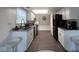 Galley kitchen with granite countertops and stainless steel appliances at 4059 Eagle Cove W W Dr, Indianapolis, IN 46254