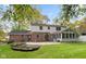 Two-story house exterior with brick and siding, and a sunroom at 4338 Briarwood Dr, Indianapolis, IN 46250