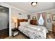 Bedroom with antique wooden headboard and floral bedding at 560 N 14Th St, Noblesville, IN 46060