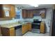 Kitchen features granite countertops and stainless steel appliances at 5709 Woodland Way, Indianapolis, IN 46254