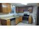 Kitchen featuring granite countertops and wood cabinets at 5709 Woodland Way, Indianapolis, IN 46254