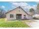 Tan brick house with a two-car garage and landscaping at 6800 Beech Grove Rd, Martinsville, IN 46151