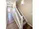 Bright entryway with staircase, hardwood floors, and view of living area at 7043 Tyler Ln, Indianapolis, IN 46217