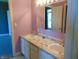 Bathroom with double sink vanity, large mirror, and natural light reflecting off the marble countertop at 7099 S 1100 W, Jamestown, IN 46147