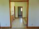 Hallway leading to bathroom with vanity, toilet and shower with step-up access at 7099 S 1100 W, Jamestown, IN 46147