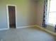 Cozy bedroom with carpeted floors, grey walls, and ample natural light at 7099 S 1100 W, Jamestown, IN 46147