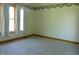 Carpeted bedroom with floral wallpaper border and three windows at 7099 S 1100 W, Jamestown, IN 46147