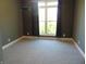 Bedroom features a window dressed with patterned curtains and neutral walls and flooring at 7099 S 1100 W, Jamestown, IN 46147