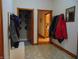 Bright entryway with coat hooks and view to kitchen at 7099 S 1100 W, Jamestown, IN 46147