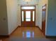 Bright foyer with hardwood floors, chandelier, and decorative front door at 7099 S 1100 W, Jamestown, IN 46147
