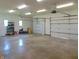Spacious three-car garage with concrete floor and three overhead doors at 7099 S 1100 W, Jamestown, IN 46147