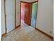 Hallway with multiple doorways, wood trim, and tile floors at 7099 S 1100 W, Jamestown, IN 46147