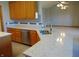 Open concept kitchen with wooden cabinets, stainless steel appliances, and a living room view at 7099 S 1100 W, Jamestown, IN 46147