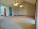 Spacious living room features a high ceiling with ceiling fans and carpeted floors at 7099 S 1100 W, Jamestown, IN 46147
