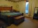 Spacious main bedroom with large bed, chest, and mirror at 7099 S 1100 W, Jamestown, IN 46147