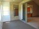 Enclosed sunroom with brick walls and sliding door that offers access to the home's interior at 7099 S 1100 W, Jamestown, IN 46147