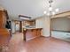 Open kitchen leading into a dining area with a decorative chandelier and wood floors at 753 N 700 E, Franklin, IN 46131