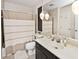 Bathroom with shower, toilet and a dark brown vanity at 8021 E 20Th St, Indianapolis, IN 46219