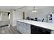 Kitchen island with seating area and built-in dishwasher at 8021 E 20Th St, Indianapolis, IN 46219