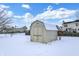 Snowy backyard with shed and fence in winter at 10361 Cerulean Dr, Noblesville, IN 46060