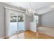 Bright dining room with hardwood floors and a chandelier at 10361 Cerulean Dr, Noblesville, IN 46060