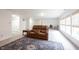 Finished basement showcasing a cozy seating area, neutral carpet, and bright natural light at 10406 Corning Way, Fishers, IN 46038