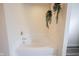 Bathroom features a large white bathtub with bright natural light at 10406 Corning Way, Fishers, IN 46038