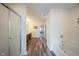 Bright bathroom with a shower, tub, wood look flooring, and and vanity at 10406 Corning Way, Fishers, IN 46038