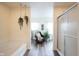 Bathroom featuring a cozy sitting area with plant life, a bathtub, and glass shower at 10406 Corning Way, Fishers, IN 46038