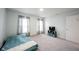 Bright bedroom featuring neutral walls, soft carpet, and a mounted tv at 10406 Corning Way, Fishers, IN 46038