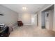 Bonus room with carpet, an accent chair, and custom storage space at 10406 Corning Way, Fishers, IN 46038