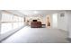 Expansive bonus room with soft carpeting, a media area, and ample natural light at 10406 Corning Way, Fishers, IN 46038