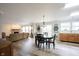 Open concept dining area featuring hardwood floors, modern decor, and natural light at 10406 Corning Way, Fishers, IN 46038