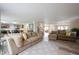 Open-concept living room featuring wood floors, comfortable seating, and modern decor at 10406 Corning Way, Fishers, IN 46038