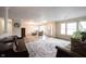 Open-concept living area with wood flooring, neutral decor, and an abundance of light at 10406 Corning Way, Fishers, IN 46038