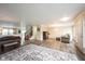 Expansive living space showcasing wood-look floors and a seamless open-concept design at 10406 Corning Way, Fishers, IN 46038