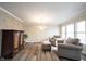 Cozy living room featuring new floors, a ceiling fan, and neutral colored walls at 10406 Corning Way, Fishers, IN 46038