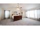 Bright main bedroom featuring a ceiling fan, neutral carpet, and light from several windows at 10406 Corning Way, Fishers, IN 46038