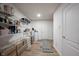 Well-organized storage room with ample shelving and wood-look flooring at 10406 Corning Way, Fishers, IN 46038